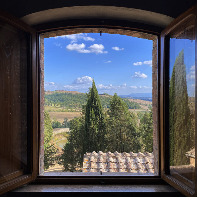 Panoramic view of countryside from a window of our luxury hotel in Tuscany, Siena