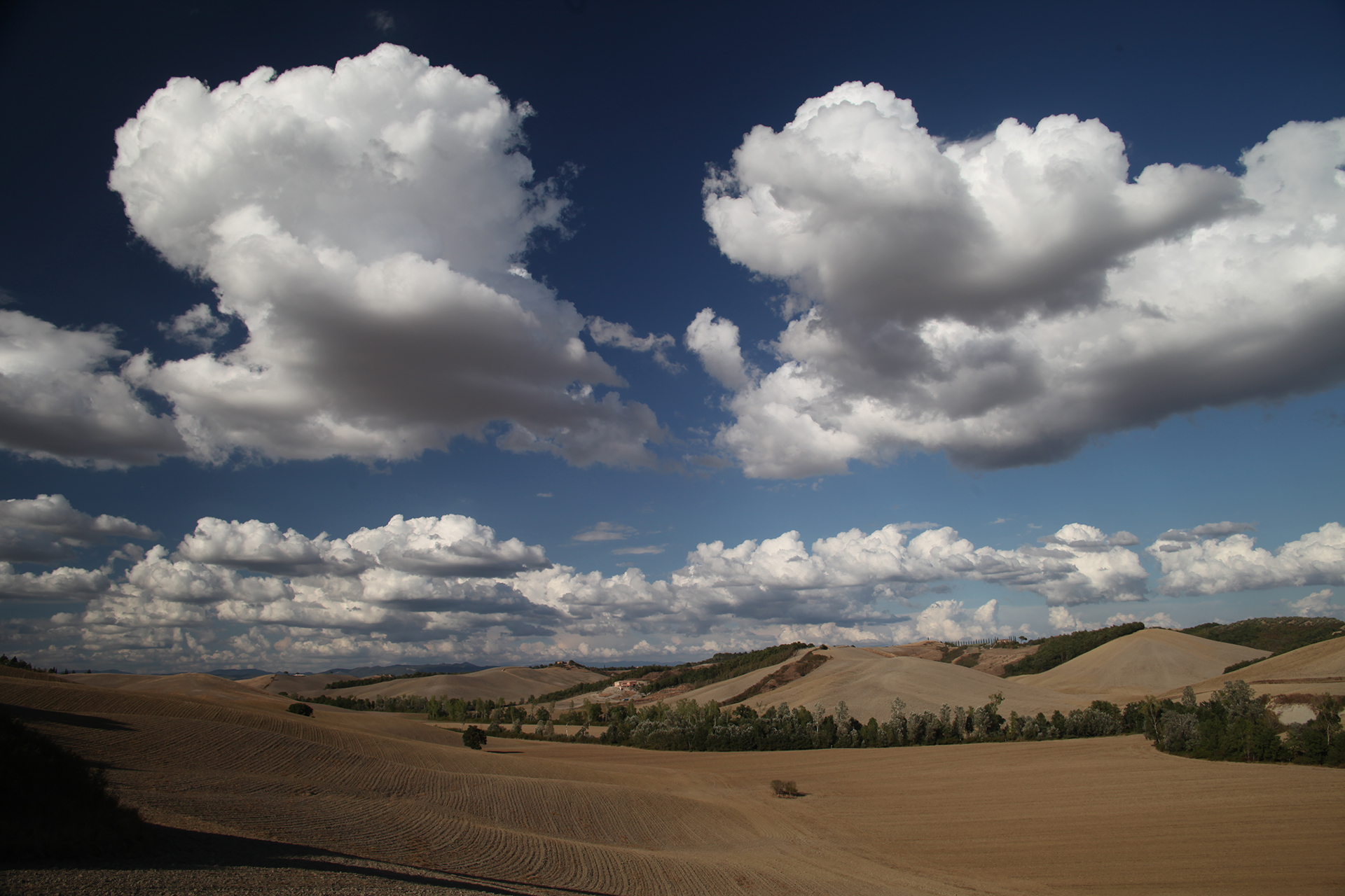 Landscape of Tuscan hills and cloudy sky, Siena